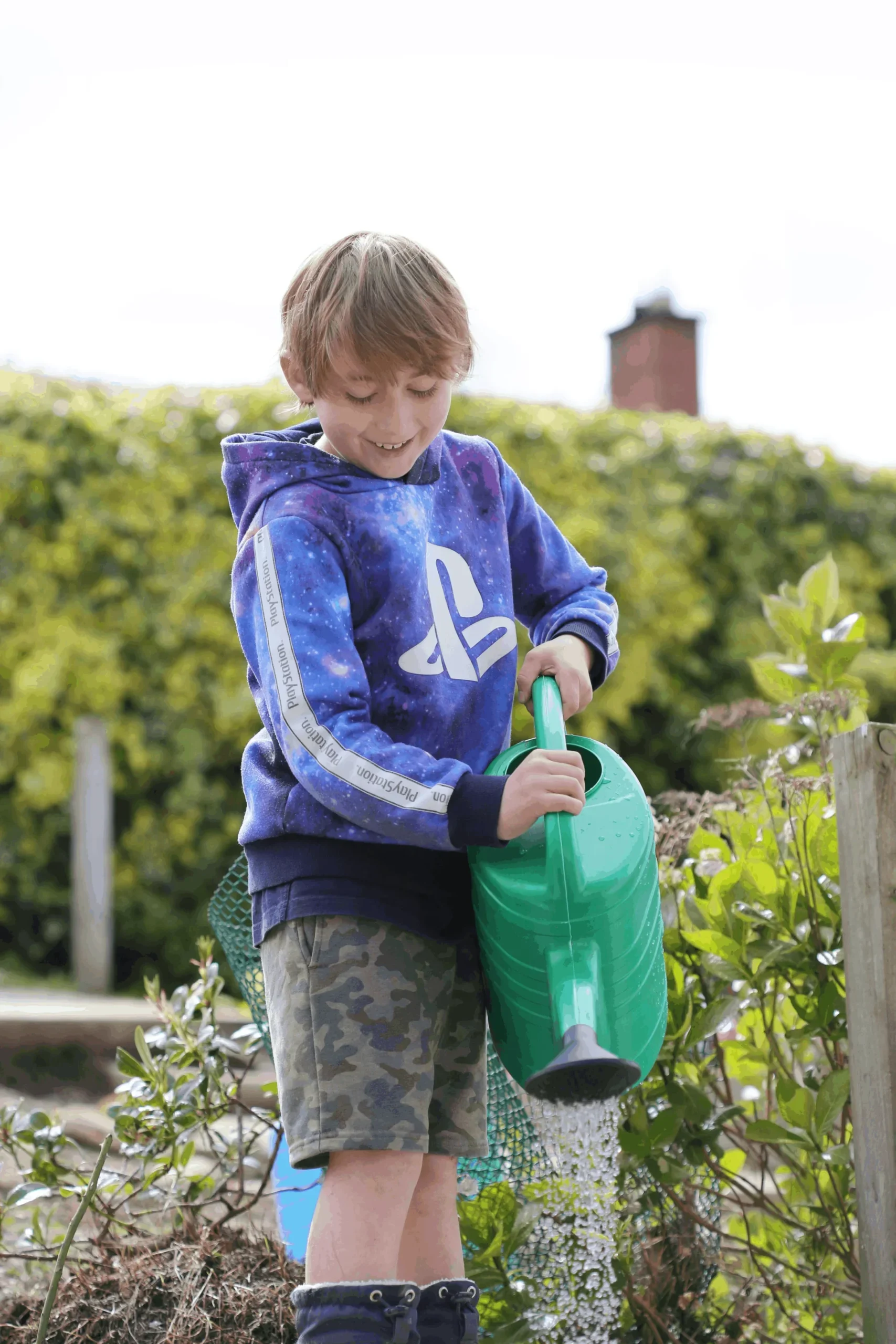 Boy with watering can