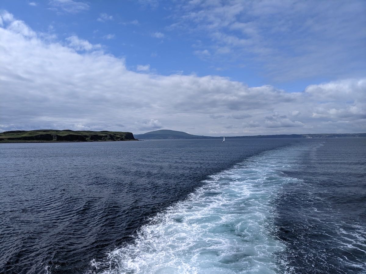 The wake of the Rathlin ferry, with the island's coastline to one side