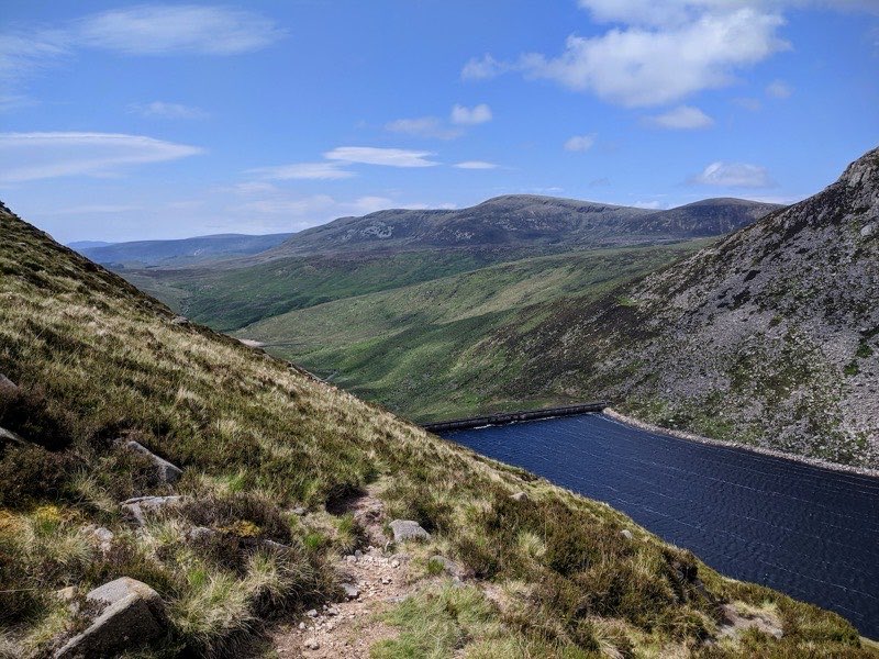 A stony path above Ben Crom Reservoir, looking along the valley into the Mourne Mountains